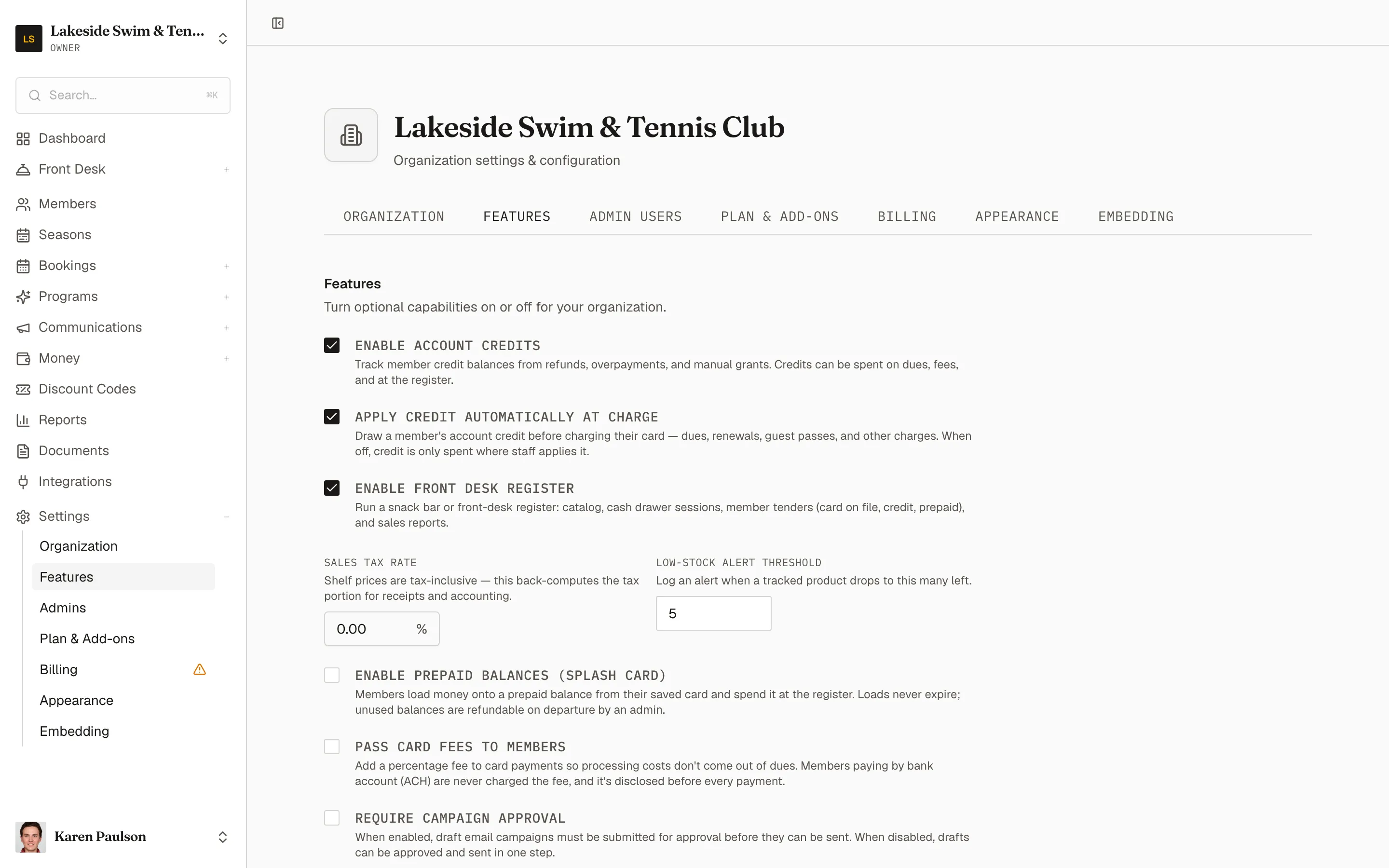 The Features tab with toggles for account credits, the register, prepaid balances, card fees, SMS, and registration